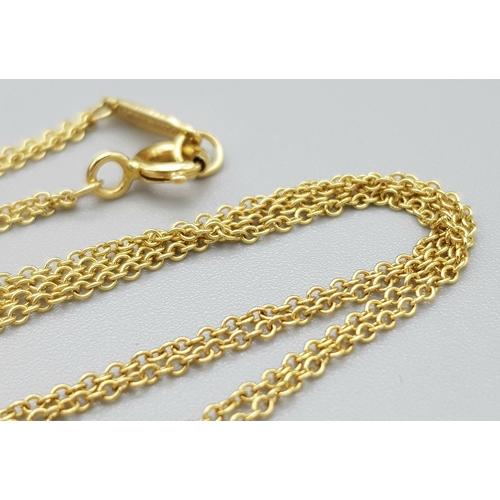 110 - A Tiffany and Co 18k yellow gold infinity necklace, 4.5g total weight, 16” chain length in original ... 