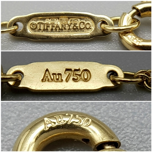 110 - A Tiffany and Co 18k yellow gold infinity necklace, 4.5g total weight, 16” chain length in original ... 