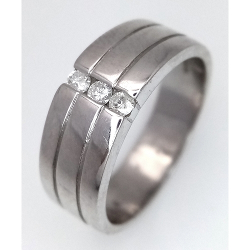 131 - A 9k white gold diamond band ring, 8.1g total weight, 0.15ct diamond weight, ring size S. Ref: NM04.