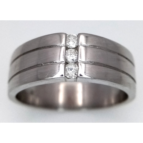 131 - A 9k white gold diamond band ring, 8.1g total weight, 0.15ct diamond weight, ring size S. Ref: NM04.