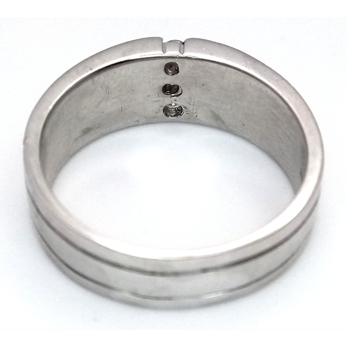 131 - A 9k white gold diamond band ring, 8.1g total weight, 0.15ct diamond weight, ring size S. Ref: NM04.