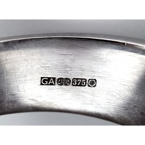 131 - A 9k white gold diamond band ring, 8.1g total weight, 0.15ct diamond weight, ring size S. Ref: NM04.