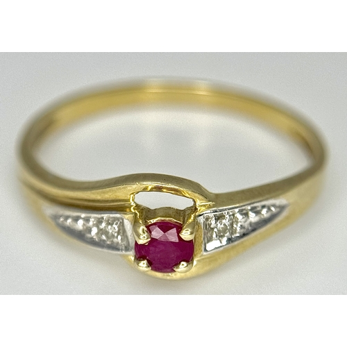 144 - A 9K Yellow Gold Ruby and Diamond Crossover Ring. Size P 1/2. 1.55g.