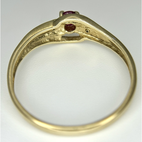144 - A 9K Yellow Gold Ruby and Diamond Crossover Ring. Size P 1/2. 1.55g.