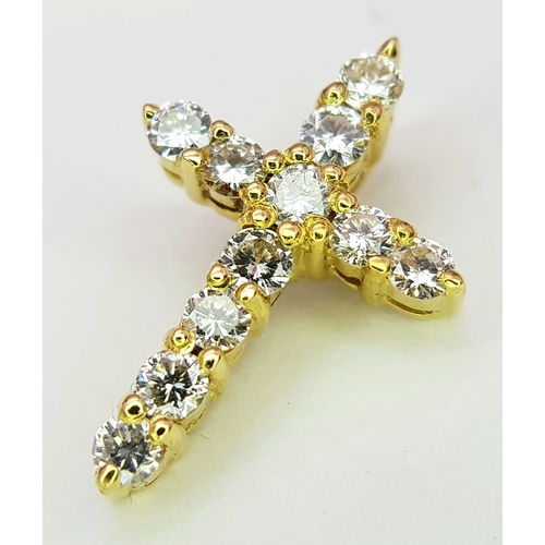 180 - AN 18K YELLOW GOLD DIAMOND SET CROSS PENDANT. 0.50CTW. 1.7G. 18MM x 12MM.
REF - JP4001.