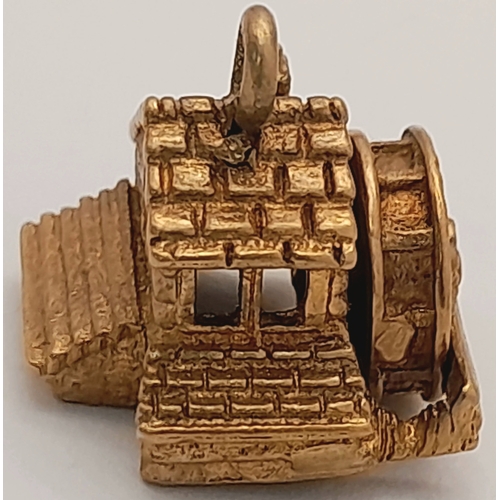 724 - A 9K Yellow Gold House Pendant. Movable water wheel! 12mm. 3.1g.