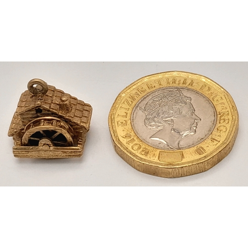 724 - A 9K Yellow Gold House Pendant. Movable water wheel! 12mm. 3.1g.