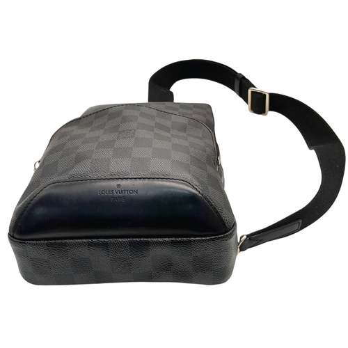 76 - A Louis Vuitton Damier Graphite Avenue Sling Bag. Black and grey Damier Graphite coated canvas exter... 