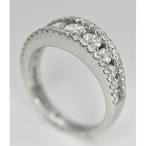 100 - An 18K White Gold Diamond Fancy Half-Eternity Ring. c. 1.1ctw of brilliant round cut graduating diam... 