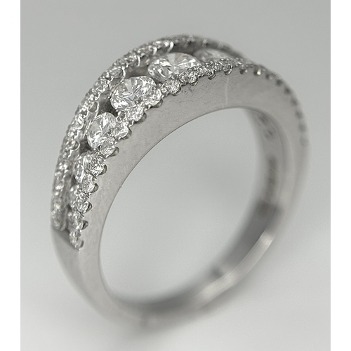 100 - An 18K White Gold Diamond Fancy Half-Eternity Ring. c. 1.1ctw of brilliant round cut graduating diam... 