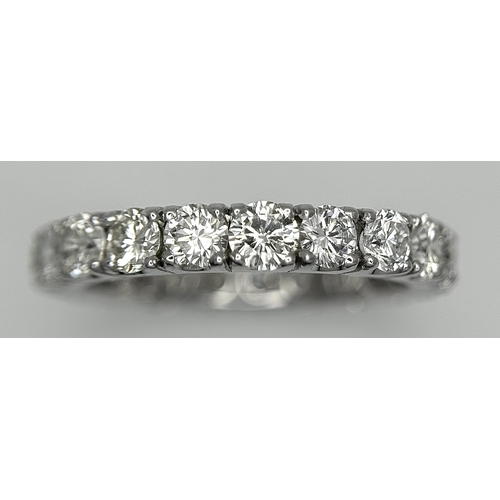 128 - A 950 Platinum Diamond Eternity Ring. 21 round brilliant cut diamonds - 3.25ctw. VS1/2 clarity. G-H ... 