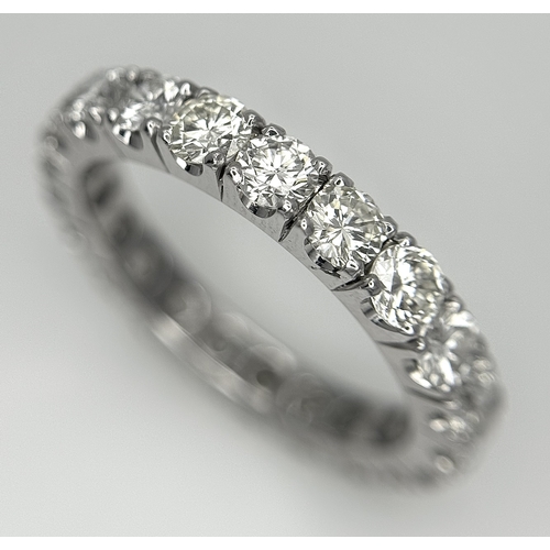 128 - A 950 Platinum Diamond Eternity Ring. 21 round brilliant cut diamonds - 3.25ctw. VS1/2 clarity. G-H ... 