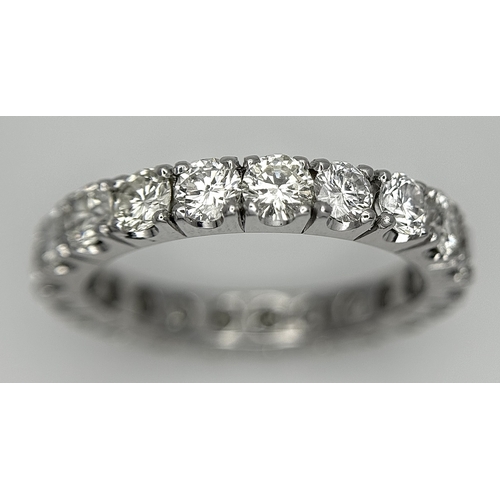 128 - A 950 Platinum Diamond Eternity Ring. 21 round brilliant cut diamonds - 3.25ctw. VS1/2 clarity. G-H ... 