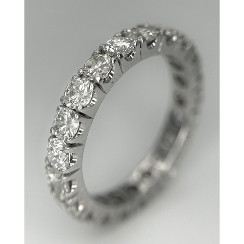 128 - A 950 Platinum Diamond Eternity Ring. 21 round brilliant cut diamonds - 3.25ctw. VS1/2 clarity. G-H ... 