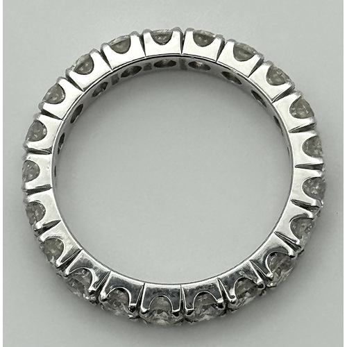 128 - A 950 Platinum Diamond Eternity Ring. 21 round brilliant cut diamonds - 3.25ctw. VS1/2 clarity. G-H ... 