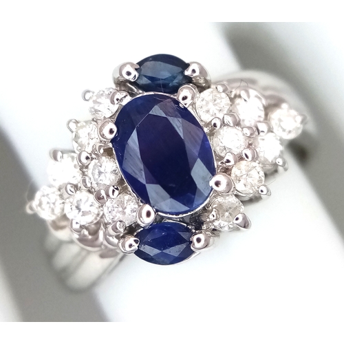 142 - An 18K White Gold, Diamond and Sapphire Ring. c. 1ct of high grade sapphires with a c. 0.5ctw diamon... 