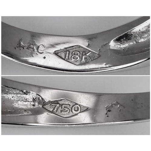 142 - An 18K White Gold, Diamond and Sapphire Ring. c. 1ct of high grade sapphires with a c. 0.5ctw diamon... 