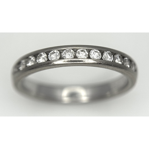 75 - AN 18K WHITE GOLD DIAMOND SET HALF ETERNITY RING. 0.25CTW. 3.5G. SIZE M. SC4075.