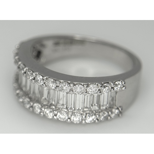 179 - An 18K White Gold Diamond Half Eternity Ring. c. 2.5ctw of baguette and round brilliant cut diamonds... 