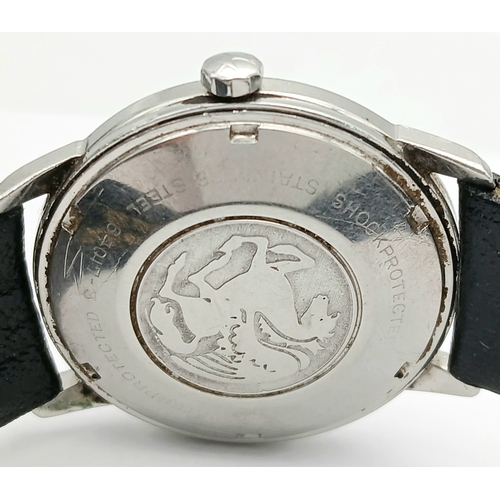 77 - Gentleman’s HAMILTON AUTOMATIC WRISTWATCH. Black leather strap . Circular Date window at 6 o’clock. ... 