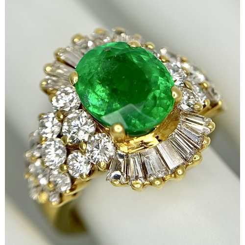 79 - An 18K Yellow Gold Emerald and Diamond Ring. A 2ct central oval cut Brazilian emerald is surrounded ... 