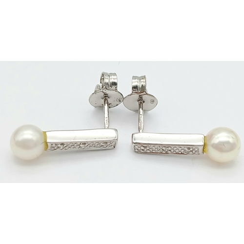 91 - Beautiful pair of 9 CARAT WHITE GOLD, DIAMOND and PEARL EARRINGS. Complete with WHITE GOLD BACKS. Fu... 
