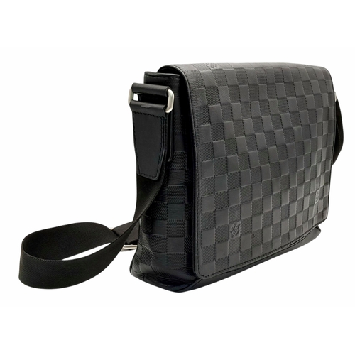 62 - A Louis Vuitton Black Damier District PM Messenger Bag. Leather exterior with silver-toned hardware,... 