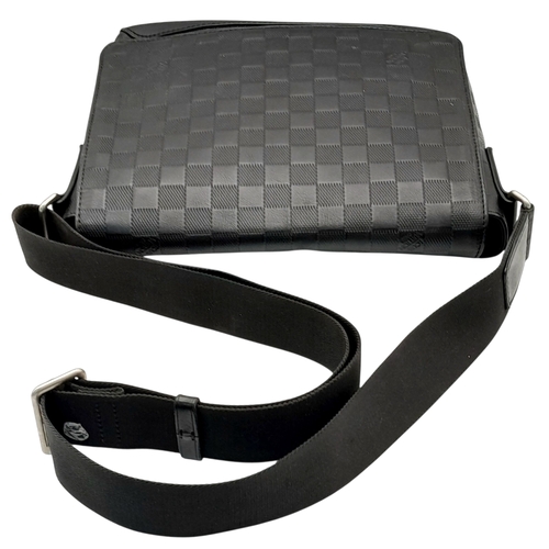 62 - A Louis Vuitton Black Damier District PM Messenger Bag. Leather exterior with silver-toned hardware,... 