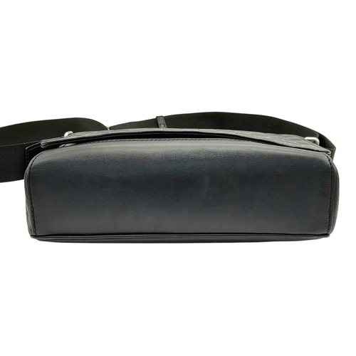 62 - A Louis Vuitton Black Damier District PM Messenger Bag. Leather exterior with silver-toned hardware,... 