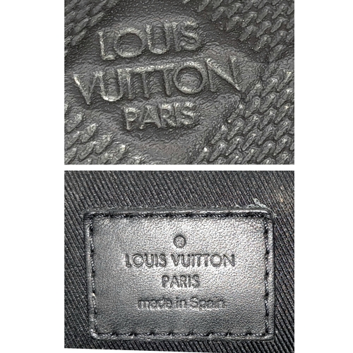 62 - A Louis Vuitton Black Damier District PM Messenger Bag. Leather exterior with silver-toned hardware,... 