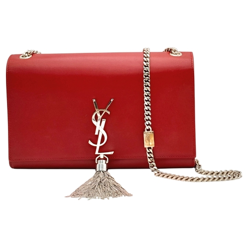 83 - A Saint Laurent Ruby Red Classic Kate Tassel Shoulder Bag. Leather exterior with silver-toned hardwa... 