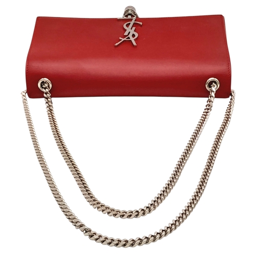 83 - A Saint Laurent Ruby Red Classic Kate Tassel Shoulder Bag. Leather exterior with silver-toned hardwa... 