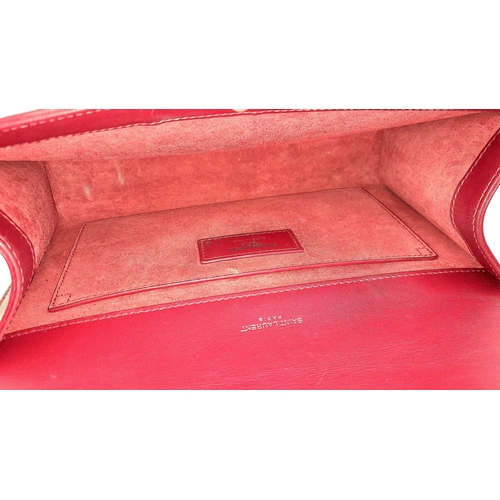 83 - A Saint Laurent Ruby Red Classic Kate Tassel Shoulder Bag. Leather exterior with silver-toned hardwa... 