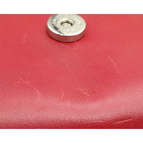 83 - A Saint Laurent Ruby Red Classic Kate Tassel Shoulder Bag. Leather exterior with silver-toned hardwa... 