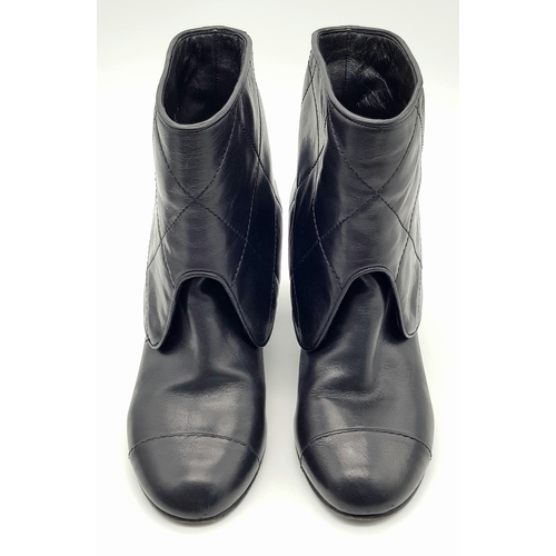 738 - A Pair of Chanel Black Quilted Leather Ankle Boots. Black leather featuring a fold-over cuff design,... 
