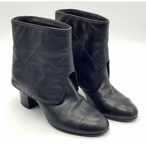 738 - A Pair of Chanel Black Quilted Leather Ankle Boots. Black leather featuring a fold-over cuff design,... 
