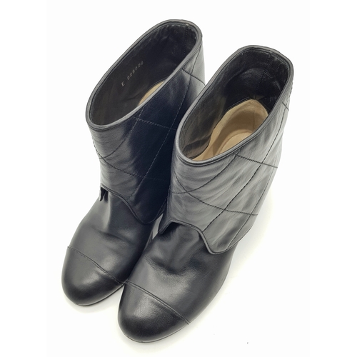 738 - A Pair of Chanel Black Quilted Leather Ankle Boots. Black leather featuring a fold-over cuff design,... 