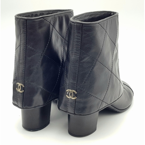 738 - A Pair of Chanel Black Quilted Leather Ankle Boots. Black leather featuring a fold-over cuff design,... 