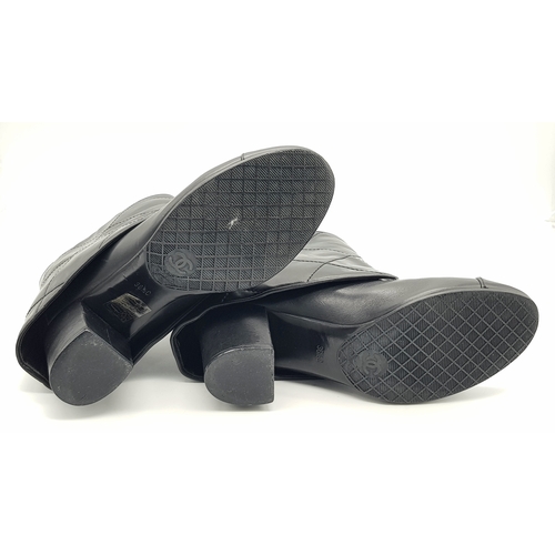 738 - A Pair of Chanel Black Quilted Leather Ankle Boots. Black leather featuring a fold-over cuff design,... 