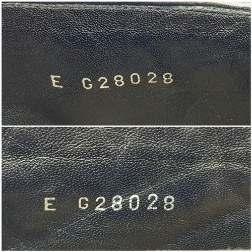 738 - A Pair of Chanel Black Quilted Leather Ankle Boots. Black leather featuring a fold-over cuff design,... 