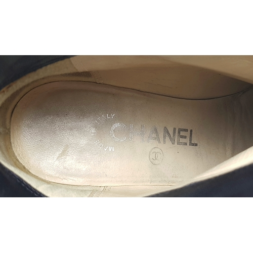 738 - A Pair of Chanel Black Quilted Leather Ankle Boots. Black leather featuring a fold-over cuff design,... 