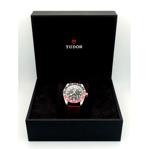 97 - A Tudor GMT Automatic Gents Watch. Model 79830RB. Brown leather strap. Stainless steel case - 42mm. ... 