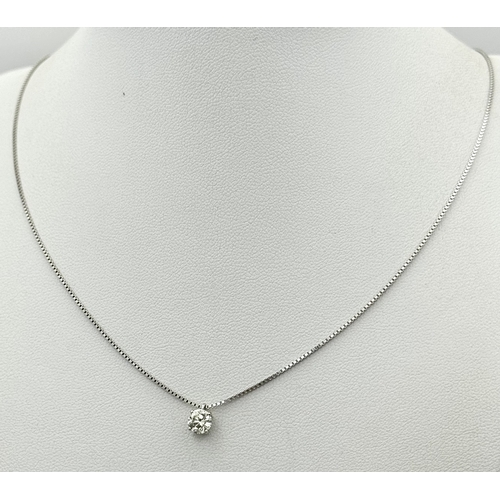 167 - A Victor Azzopardi 18K White Gold Diamond Pendant and Chain. 0.55ct VS clarity, round brilliant cut ... 