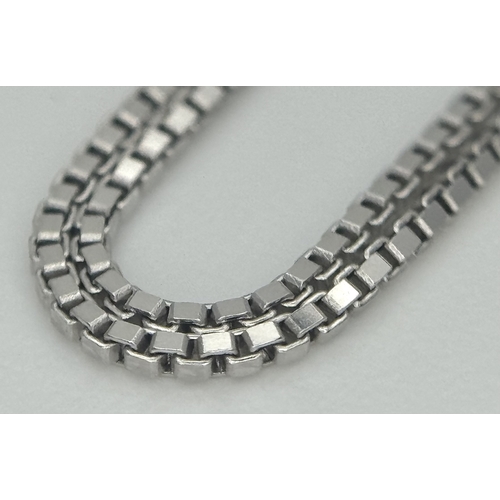 167 - A Victor Azzopardi 18K White Gold Diamond Pendant and Chain. 0.55ct VS clarity, round brilliant cut ... 