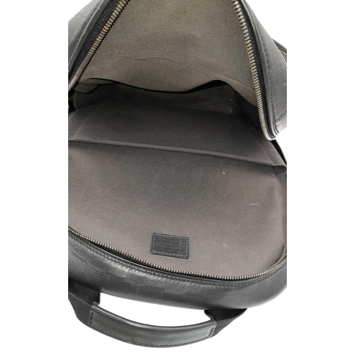 174 - A Louis Vuitton Black Damier Michael Backpack. Leather and textile exterior with silver-toned hardwa... 