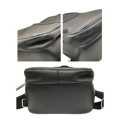 174 - A Louis Vuitton Black Damier Michael Backpack. Leather and textile exterior with silver-toned hardwa... 