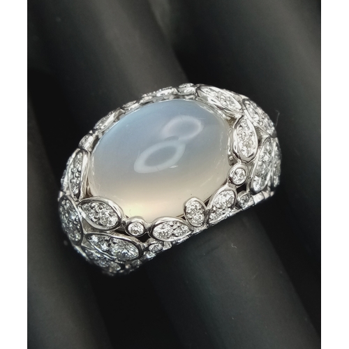 121 - A Ritz of London 18K White Gold, Diamond and Moonstone Dome Dress Ring. An 8ct hypnotising oval cut ... 