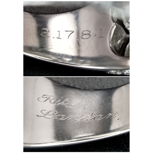 121 - A Ritz of London 18K White Gold, Diamond and Moonstone Dome Dress Ring. An 8ct hypnotising oval cut ... 