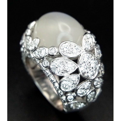 121 - A Ritz of London 18K White Gold, Diamond and Moonstone Dome Dress Ring. An 8ct hypnotising oval cut ... 