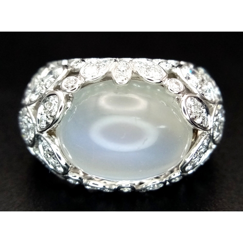 121 - A Ritz of London 18K White Gold, Diamond and Moonstone Dome Dress Ring. An 8ct hypnotising oval cut ... 